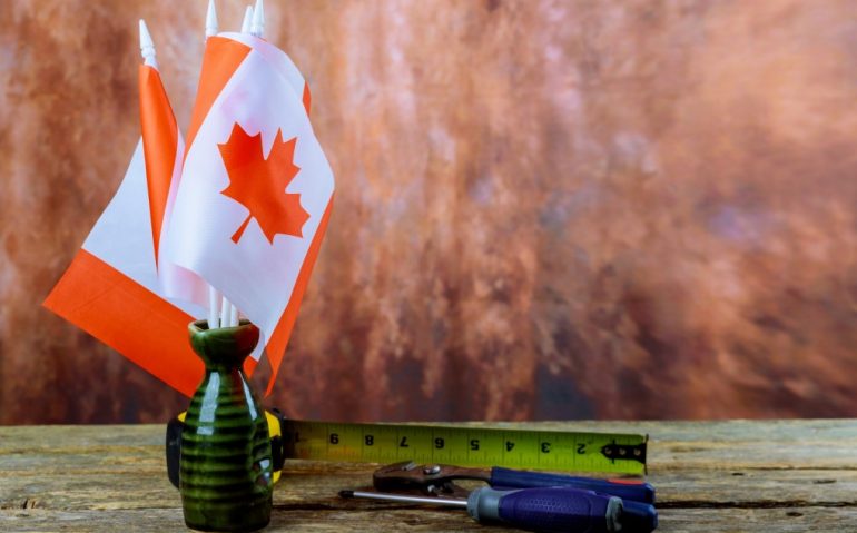 canada-happy-labor-day-hammer-wrench-a-wooden-background-labor-day-concept-canadian-flag_t20_QaZlej